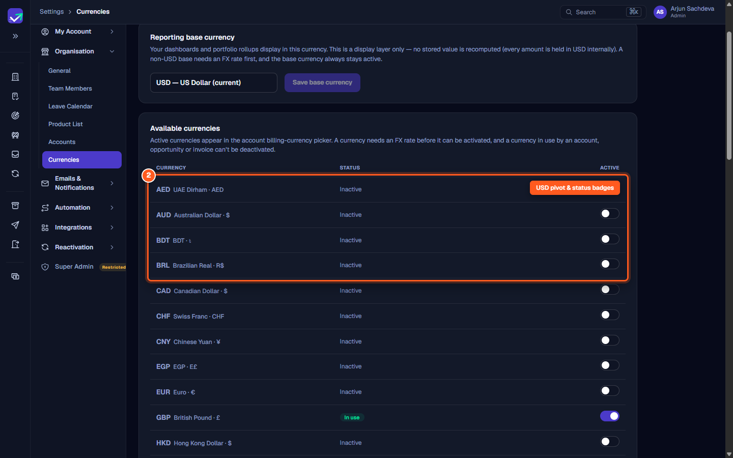 The Available currencies table showing status badges for USD Internal pivot, Base, and In use